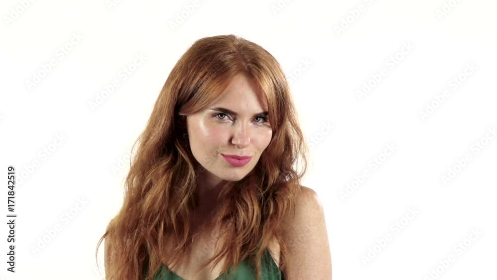 Girl is making faces and fooling around. White background. Slow motion Girl is making faces and fooling around. White background. Slow motion
