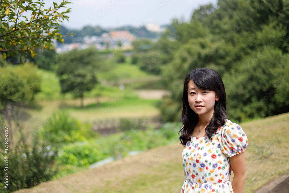 a portrait of beautiful woman in the park