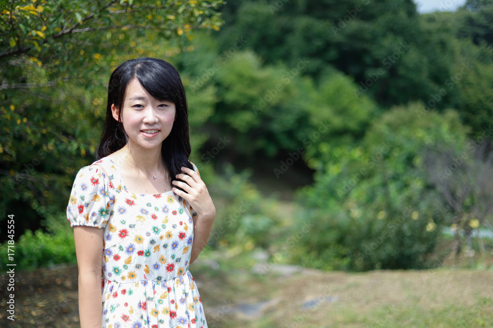 a portrait of beautiful woman in the park a portrait of beautiful woman in the park
