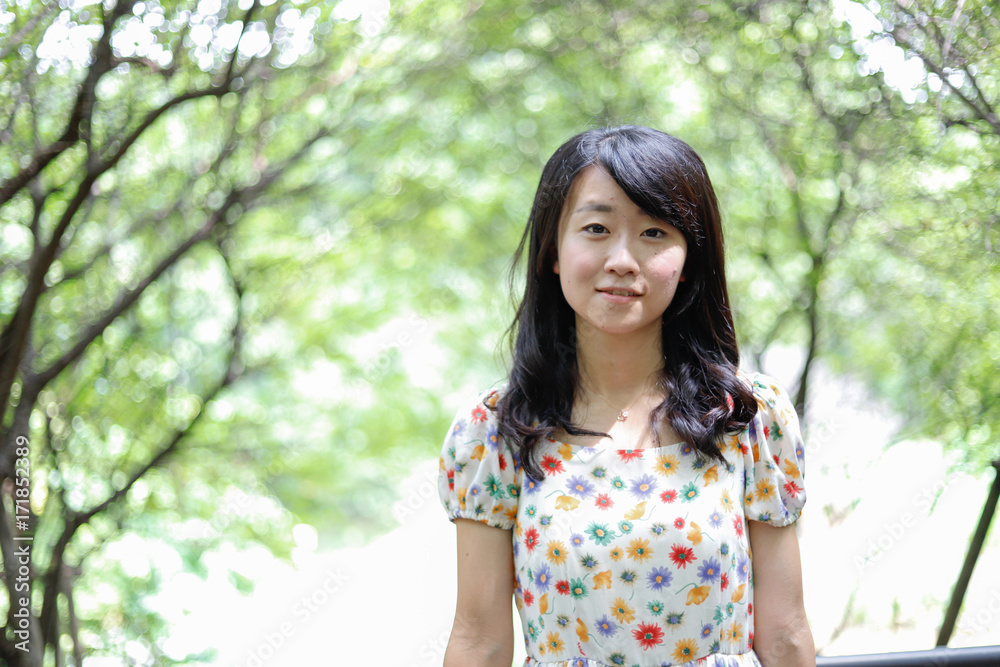 a portrait of beautiful woman in the park a portrait of beautiful woman in the park