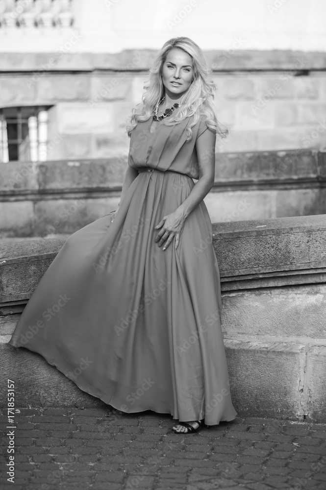 Naklejka premium portrait of a beautiful blonde near castle