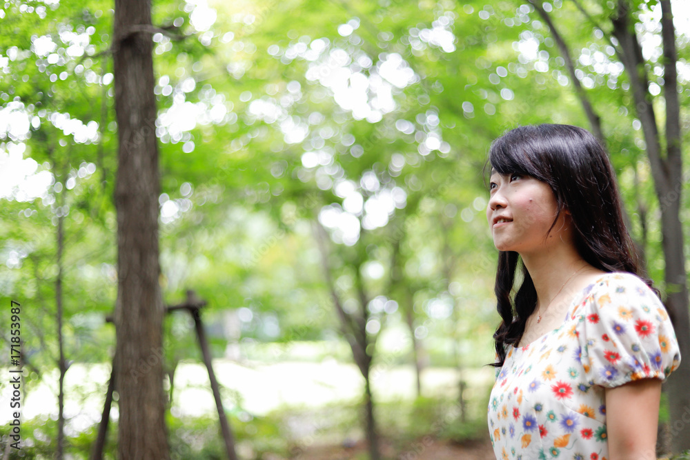 a portrait of beautiful woman in the park a portrait of beautiful woman in the park