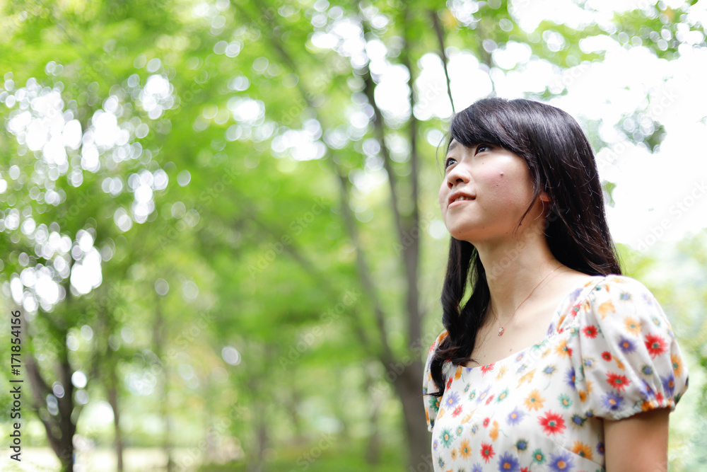 a portrait of beautiful woman in the park a portrait of beautiful woman in the park