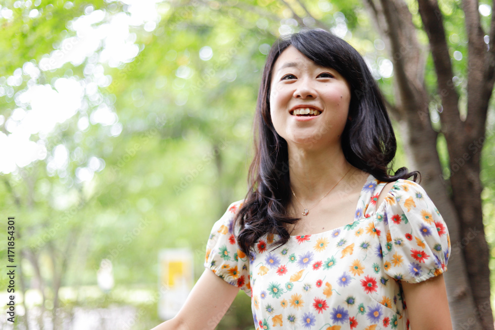 a portrait of beautiful woman in the park a portrait of beautiful woman in the park