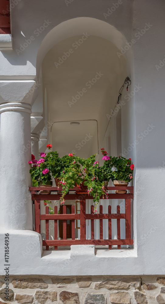 Medieval wooden balcony with flowers