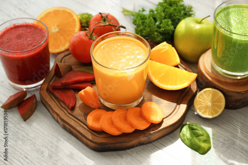 Fresh smoothies  vegetables and fruits on table