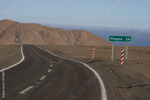 Road through the Atacama Desert to the historic coastal town of Pisagua in the Tarapaca Region of northern Chile. photo