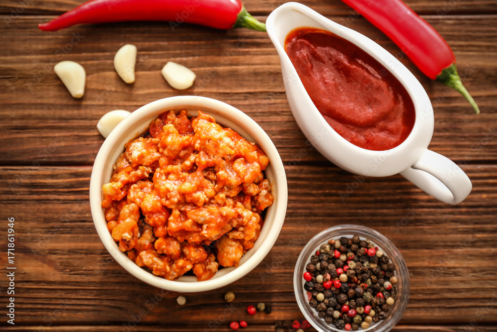 Meat sauce in ceramic bowl on kitchen table Meat sauce in ceramic bowl on kitchen table
