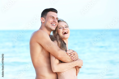 Happy young couple on sea beach