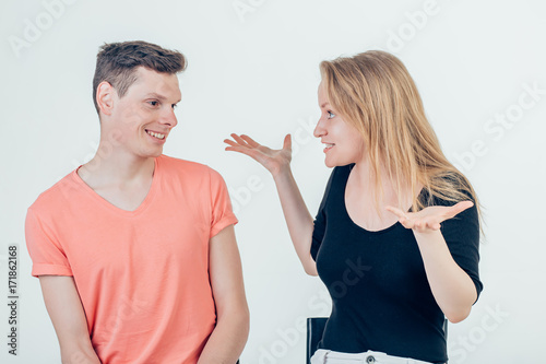 couple shrugging their shoulders having uncertainty not knowing what to do photo