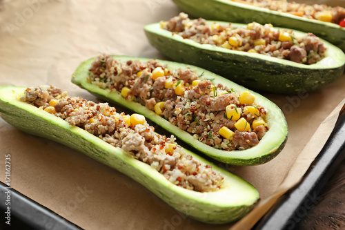 Quinoa stuffed zucchinis on baking tray