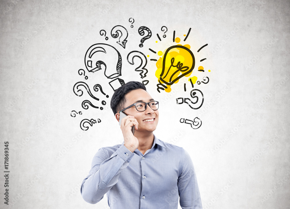 Asian businessman on phone, question, idea Asian businessman on phone, question, idea