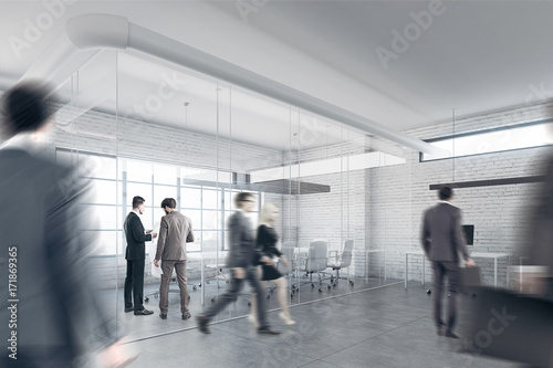 White brick office with a reception, people