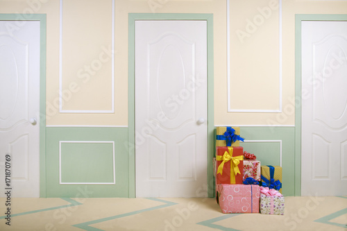 gift boxes go under the door in a bright room
