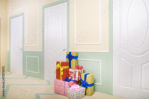 gift boxes go under the door in a bright room