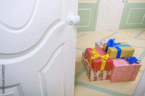 gift boxes go under the door in a bright room