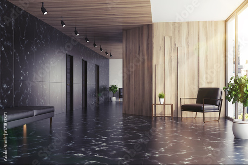 Black marble and wooden elevator hall  toned