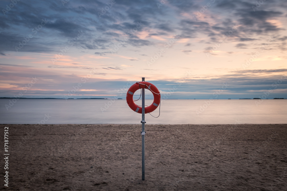 Life buoy by the sea at a summer evening in Finland