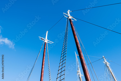 sailboat masts against sky