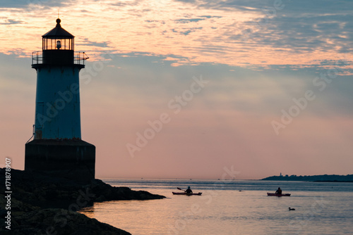 Men Canoeing near Salem Lighthouse at Dawn