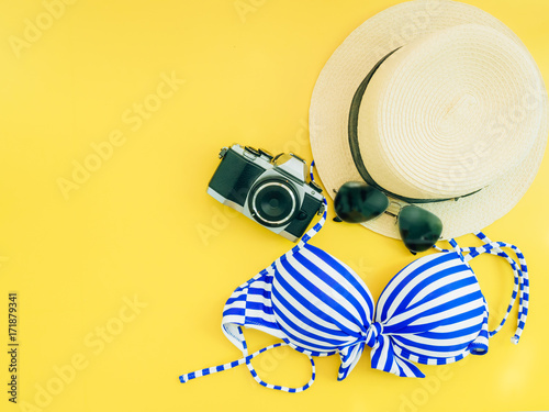 girl travel and summer cloth accessories concept with yellow background