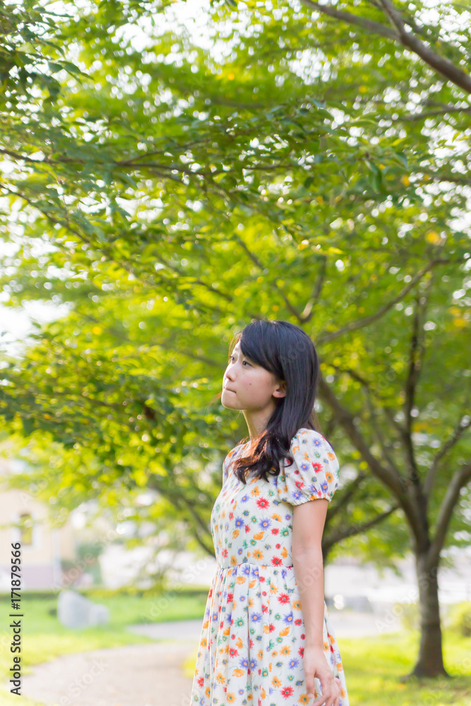 a portrait of beautiful woman in the park a portrait of beautiful woman in the park