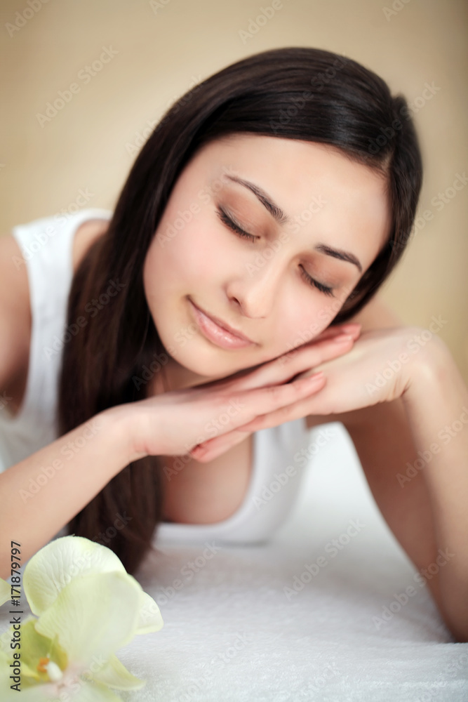 Beautiful Young Woman Getting a Face Treatment at Beauty Salon.