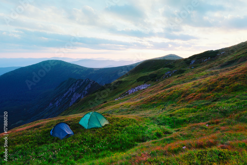 Two tents on autumn mountains