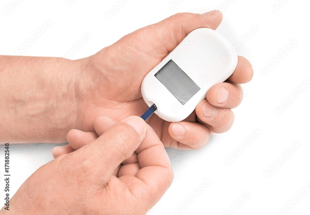 Man holding digital glucometer on white background Man holding digital glucometer on white background
