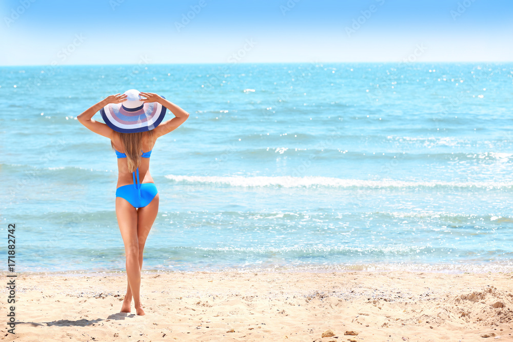 Beautiful young woman on sea beach Beautiful young woman on sea beach