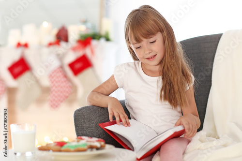 Cute little girl with book ...