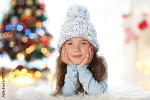 Happy little girl in hat ly...