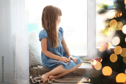 Cute little girl with gift ...