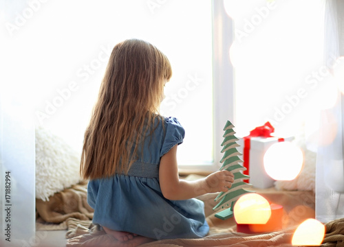 Cute little girl with gift ...