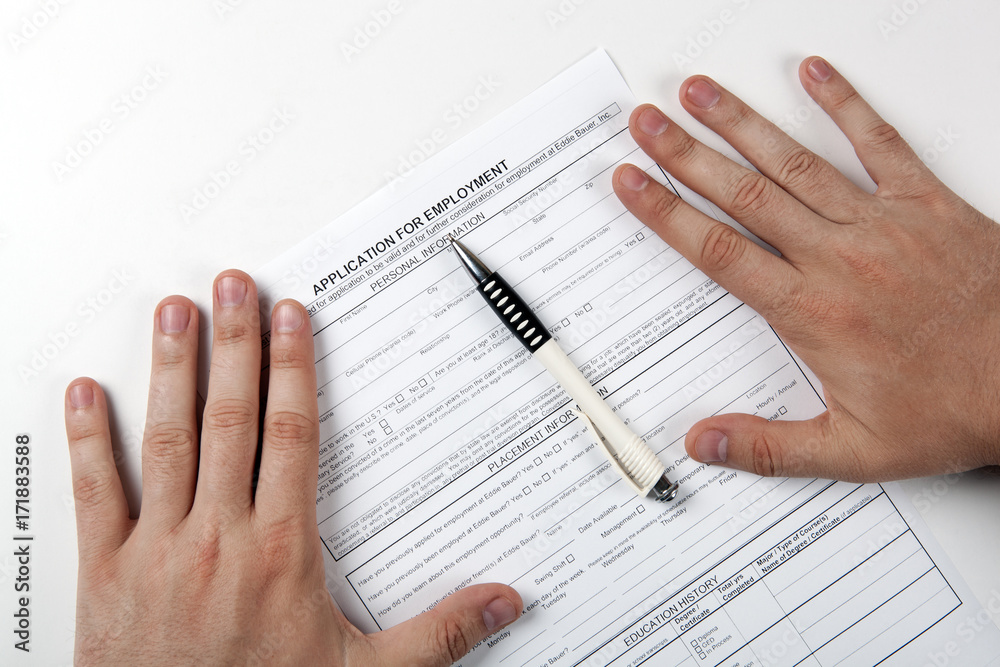 Fototapeta premium human hand and the form of the document application for employment