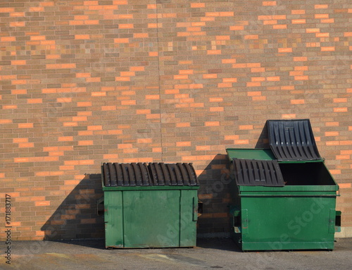 Green recycling dumpsters