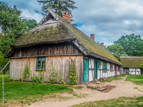 Old wooden farmstead in Kluki, Poland photo
