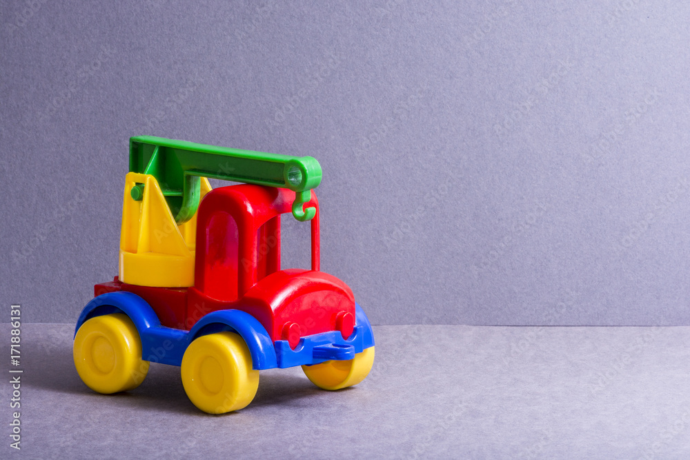 Toy truck. Toys for little children. Crane.