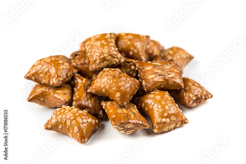 Pile of peanut butter filled pretzels isolated on a white background