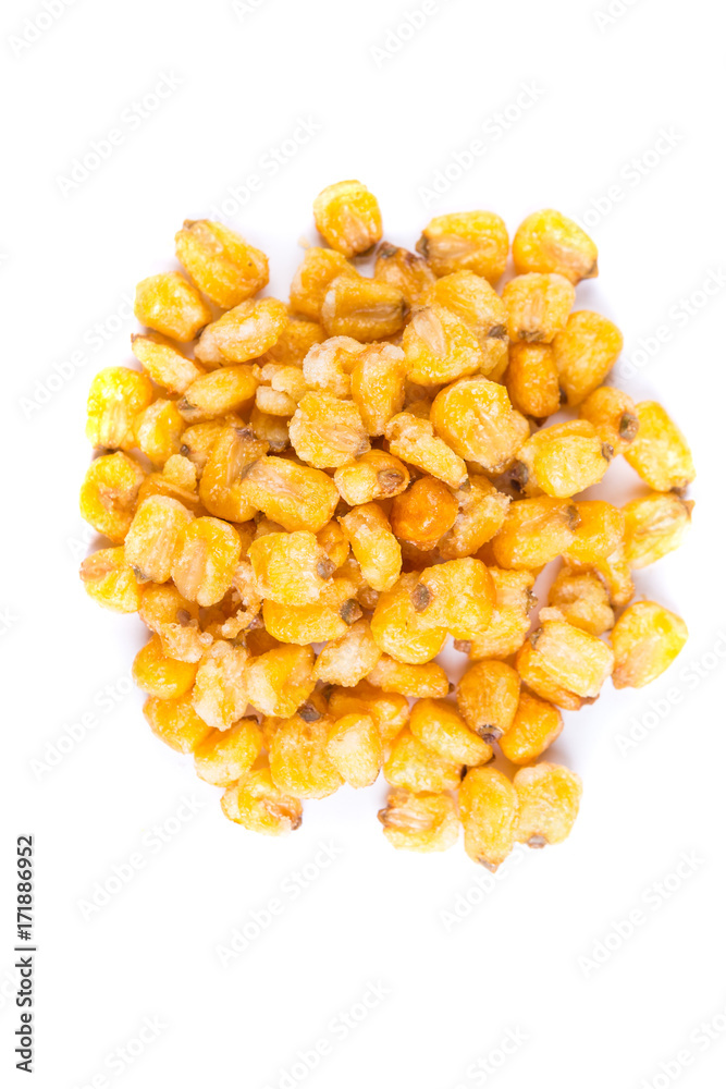 Pile of roasted spiced corn kernels isolated on a white background Pile of roasted spiced corn kernels isolated on a white background