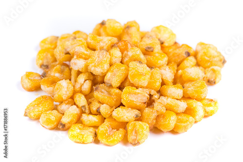 Pile of roasted spiced corn kernels isolated on a white background