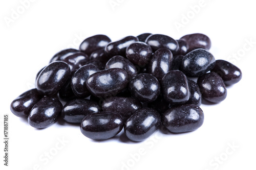 Pile of black jelly candies isolated on a white background