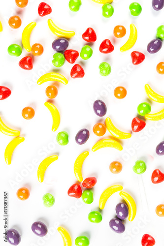 Background of fruit shaped candies isolated on a white background