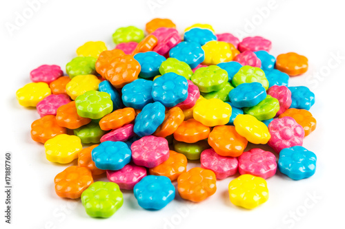 Pile of neon candy flowers isolated on a white background