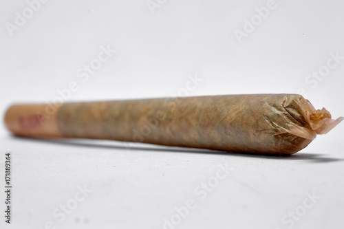 Close up of medical marijuana pre rolled indica and sativa joint