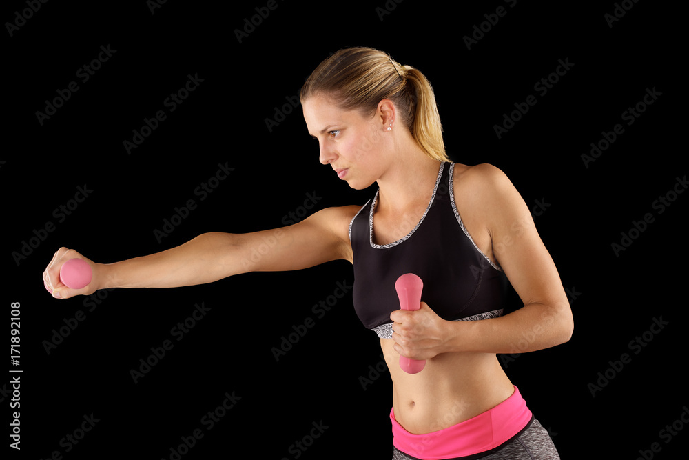 Woman lifting weights while doing aerobics. Woman lifting weights while doing aerobics.
