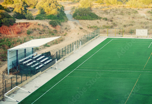 Empty football stadium with grandstands.