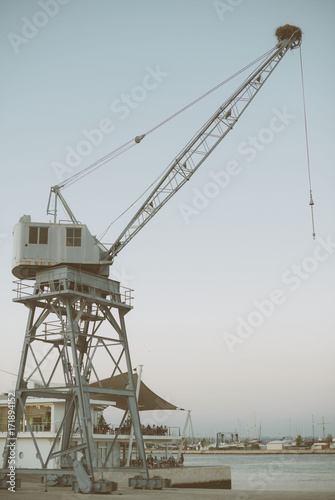 Port crane with a stork's nest on it.