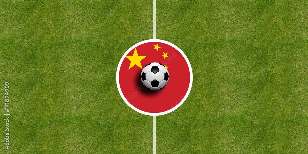 Naklejka premium China flag on a soccer field center