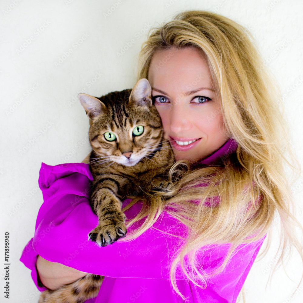 Portrait of a woman with a cat - Stock photo